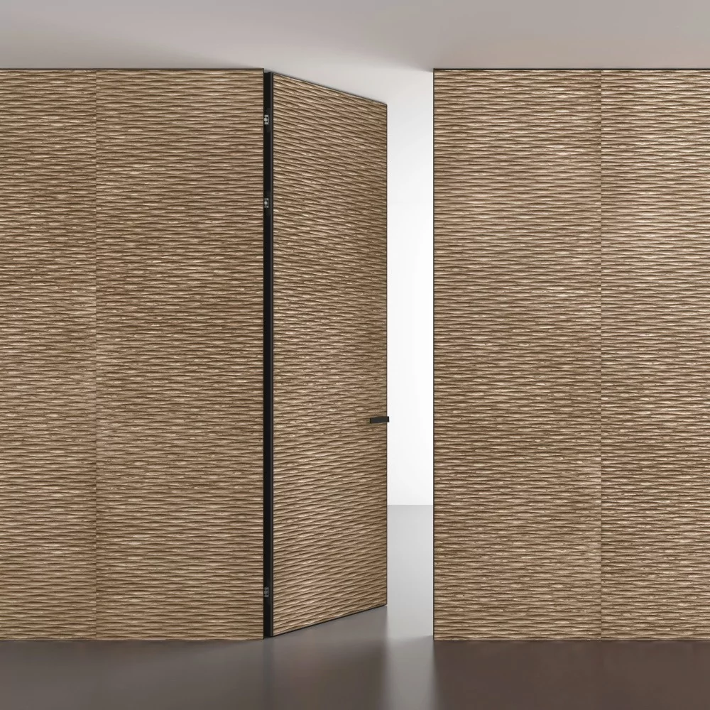 UNIFLEX–3D, Alu, Wave model, natural veneer Noce Canaletto. Hidden door frame, aluminum end edge and handle in Dark Brown color. Wall panels COVER, Wave. A variant of the door "under the ceiling".