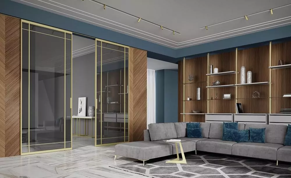 STRATUS–SLIM, Quattro model, translucent Trasparente Grafite glass, aluminum canvas frame in Soft Gold color. Sliding double–leaf partition along the wall, hidden track in the ceiling.
