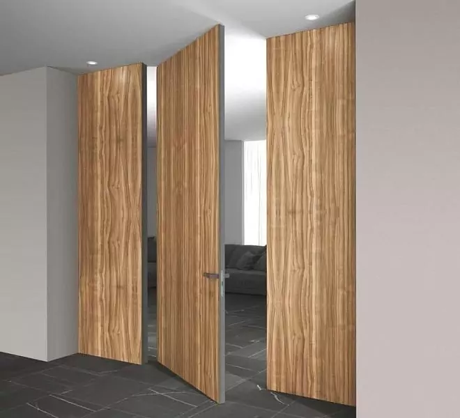 PIVOT–60, Alu, Velino model, natural veneer Noce Europeo. Hidden door frame, aluminum edge and handle in Piombo color.