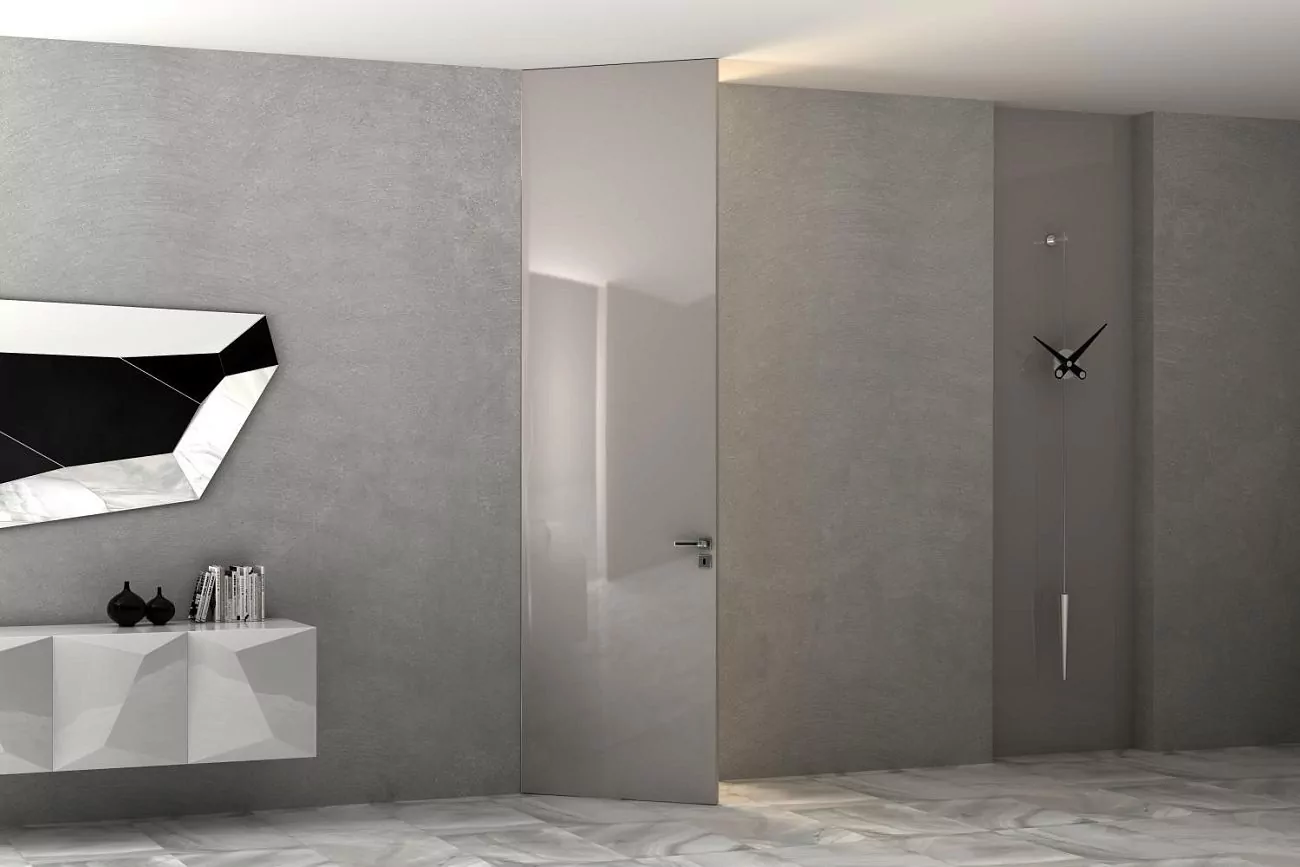 The door to the ceiling. FILO–60, glossy enamel Grigio Seta Gloss, hidden door frame in Chrome Matt finish.