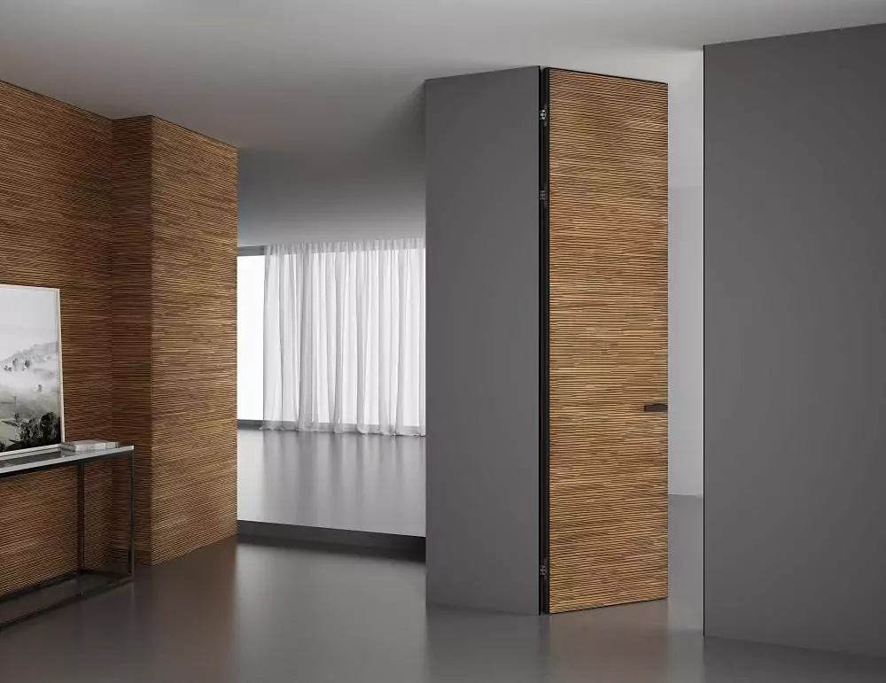 UNIFLEX–3D, Alu, Espirit model, natural veneer Noce Canaletto. Hidden door frame, aluminum end edge and handle in Black color. Wall panels COVER, Espirit. A variant of the door "under the ceiling".
