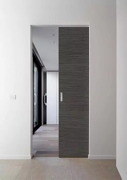 SLIDER, Alu, Vento model, natural veneer Rovere Cenere, end aluminum edge in Chrome Matt color. Sliding door in ECLISSE pocket door, SYNTHESIS LINE®.