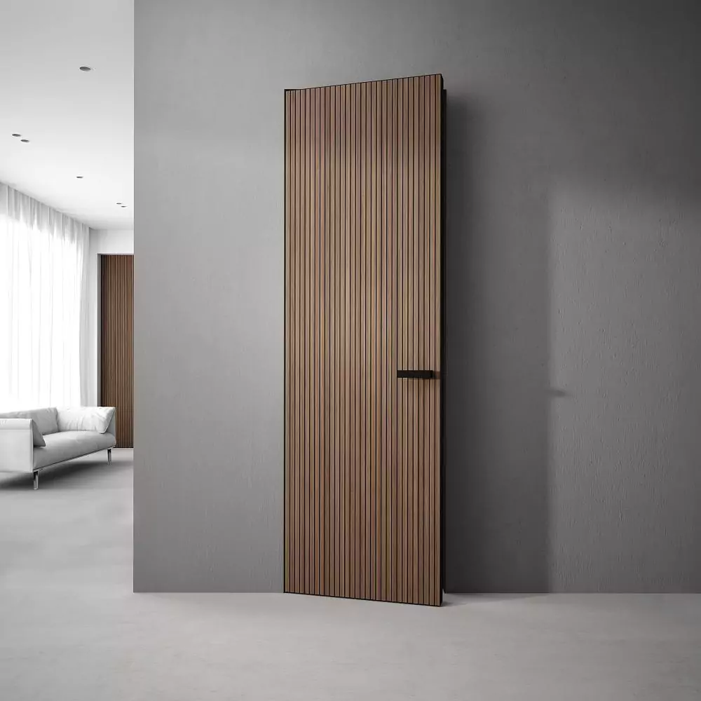 The door is UNIFLEX–3D, Alu, Step model, natural veneer Noce Canaletto. Hidden door frame , aluminum end edge and handle in Black color.