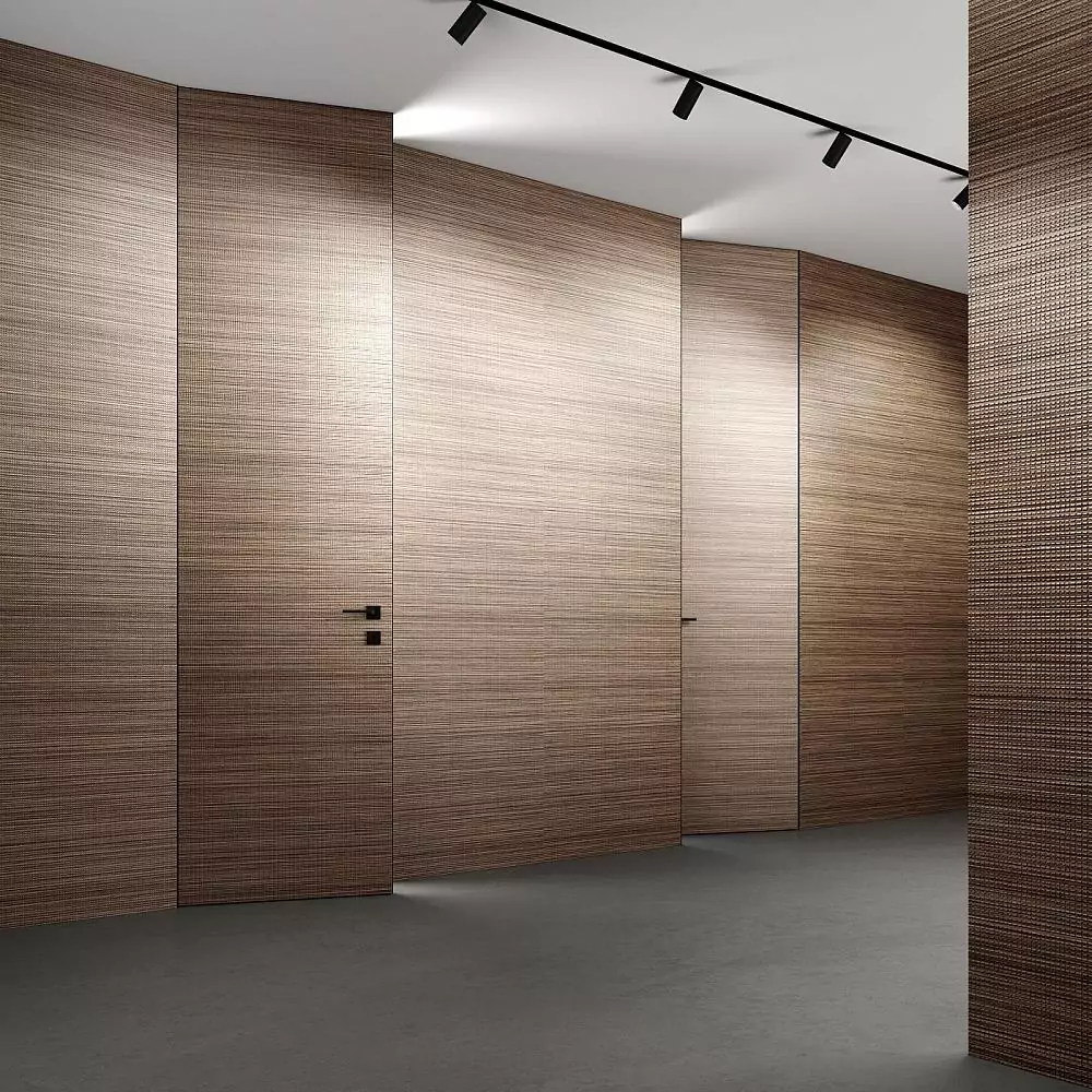 Doors UNIFLEX–3D, Alu, Bolla model, natural veneer Noce Canaletto. Hidden door frame, aluminum edge and handle in Black color. Wall panels COVER, Bolla. The option of doors "under the ceiling".
