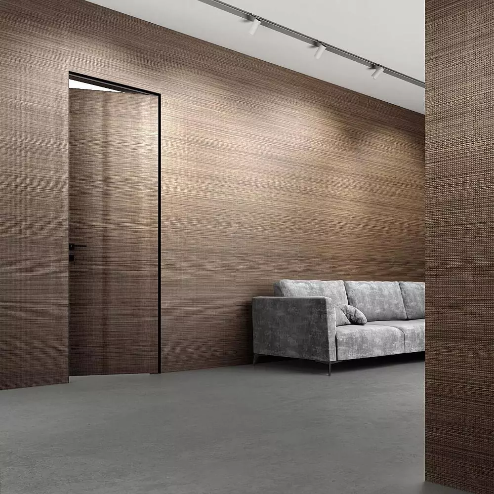 UNIFLEX–3D, Alu, Bolla model, natural veneer Noce Canaletto. Hidden door frame, aluminum edge and handle in Black color. Wall panels COVER, Bolla.