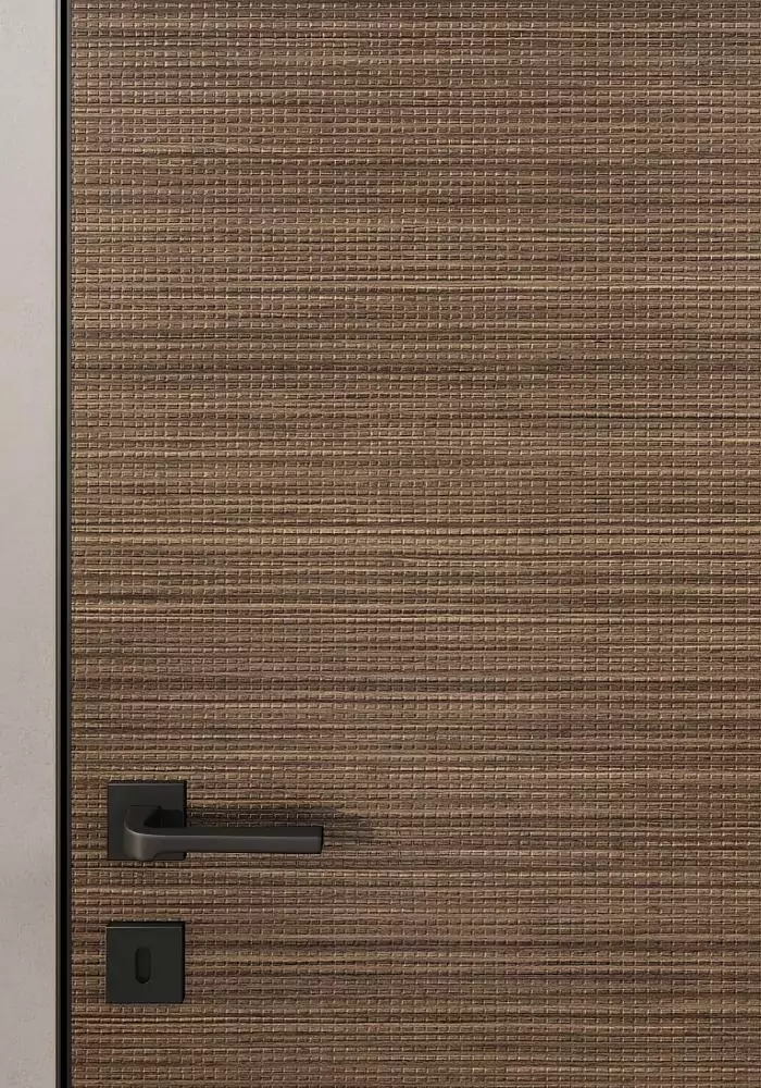 UNIFLEX–3D, Alu, Bolla model, natural veneer Noce Canaletto. Hidden door frame, aluminum edge and handle in Black color. A fragment of the door.