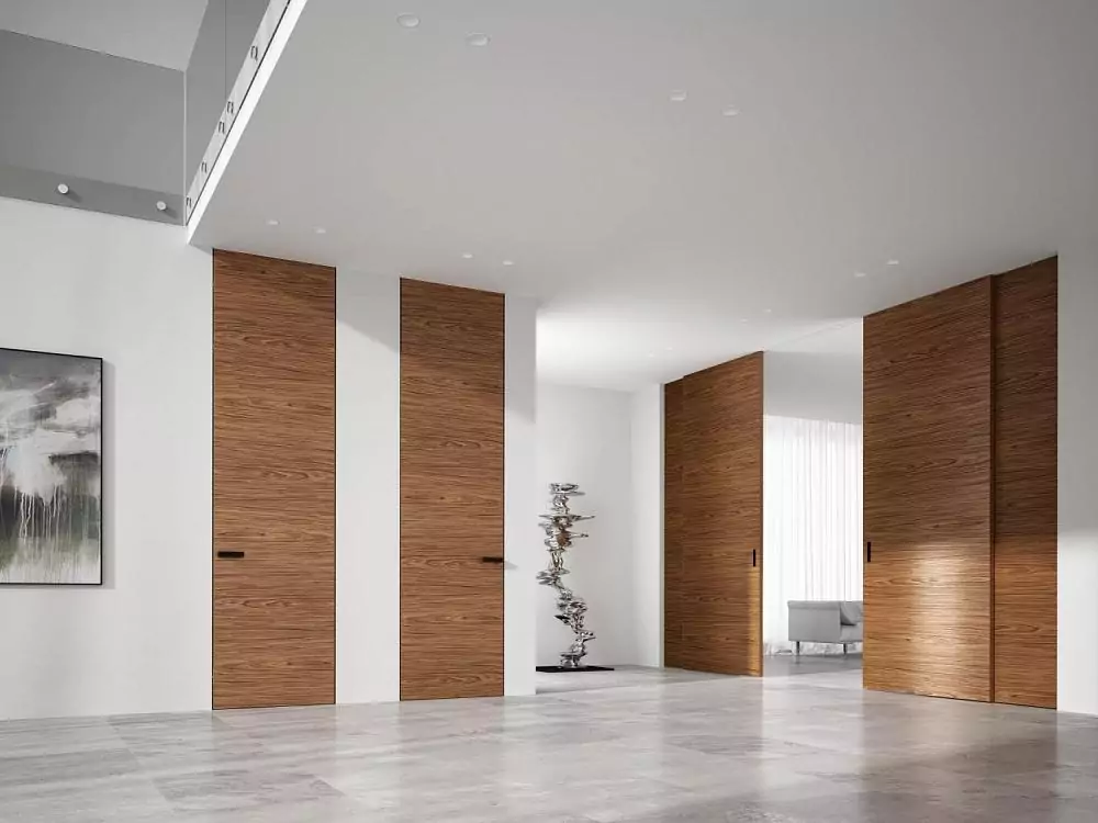 FILO–60, Alu, Vento model, Mogano natural veneer. Hidden door frame, aluminum end edge and handle in Dark Brown color. The "under the ceiling" option.