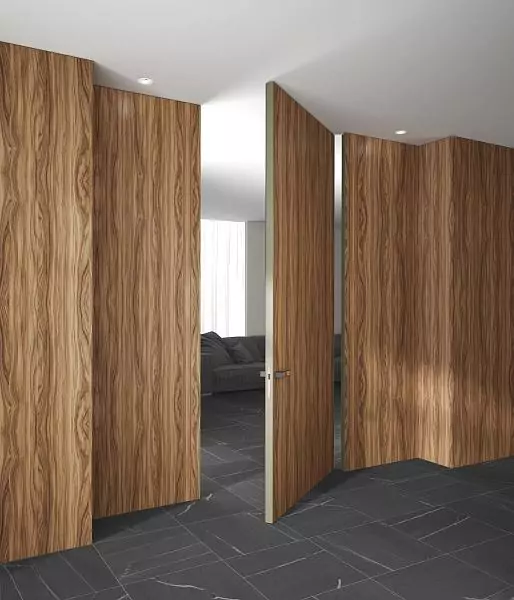 PIVOT–60, Alu, Velino model, natural veneer Noce Europeo. Hidden door frame, aluminum edge and handle in Soft Gold color.